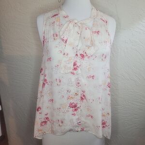Free people sleeveless button down high low blouse.
